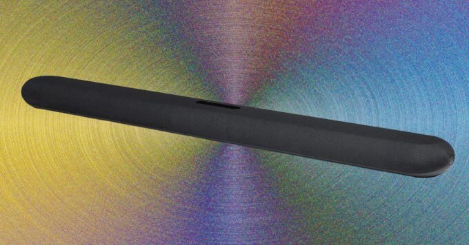 Bluesound Pulse Cinema soundbar with a wraparound fabric grille under a television