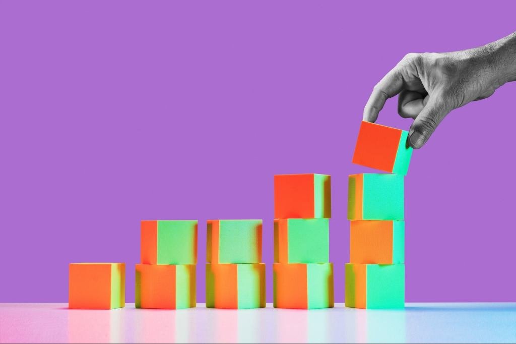 A successful entrepreneur standing confidently in front of a modern office building, symbolizing independent business growth and financial freedom.