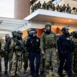 Federal agents clash with anti-ICE protesters outside a U.S. Immigration and Customs Enforcement building in Portland, Oregon.