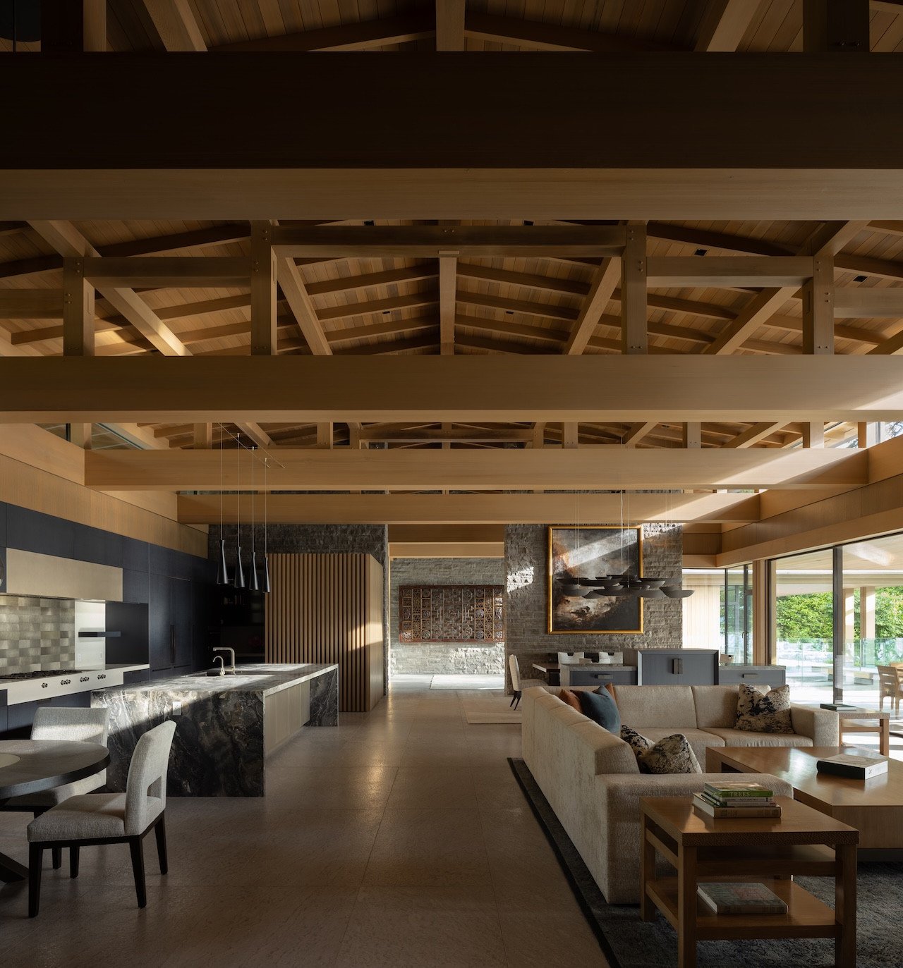 A modern single-story home built with Western red cedar and glass, nestled within a lush forest with a koi pond, overlooking the Saanich Inlet in British Columbia.