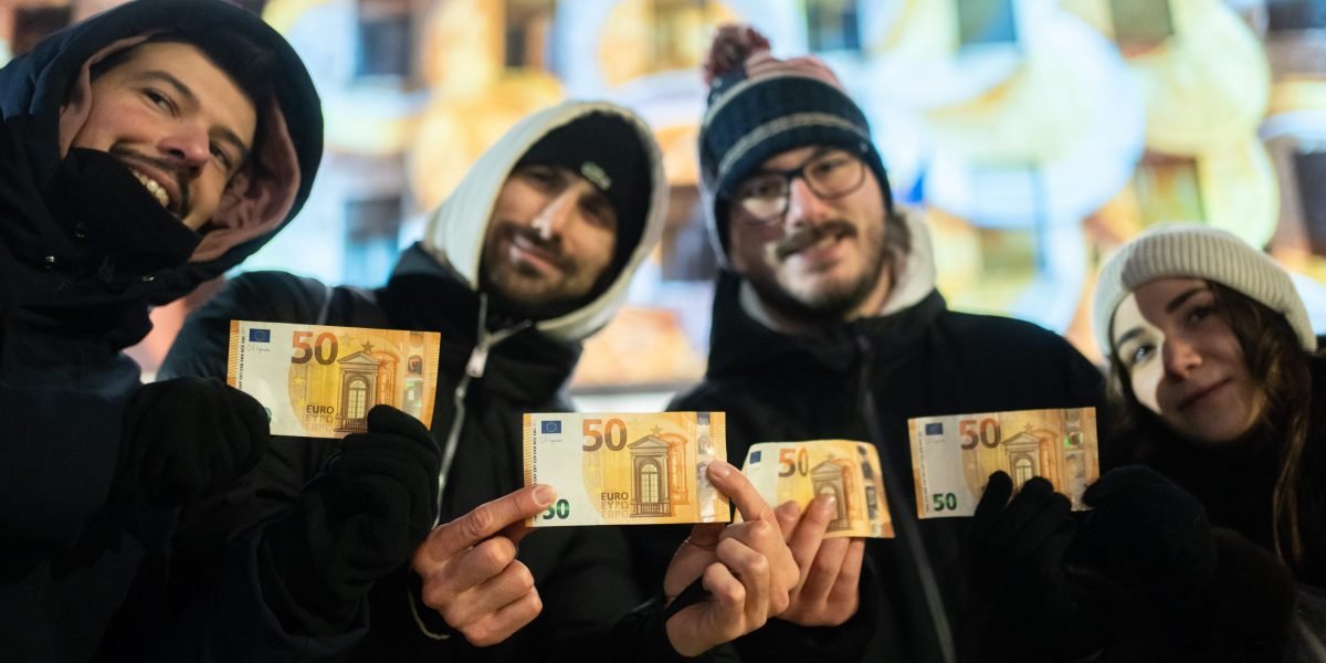 Bulgarian citizens withdrawing euros from an ATM in Sofia, marking the country's entry into the Eurozone.