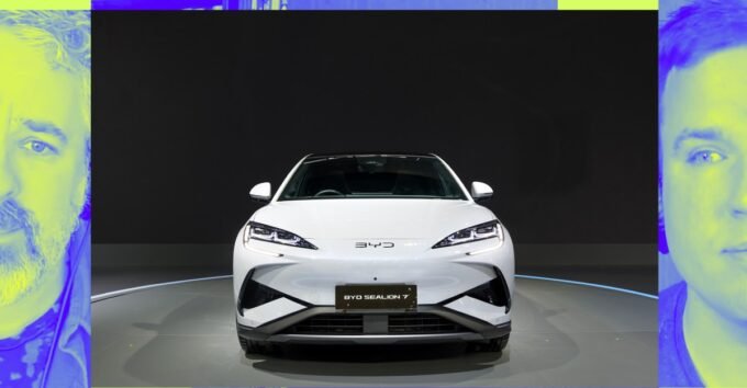 BYD electric vehicle driving alongside a Tesla, symbolizing the shift in EV market leadership.