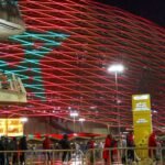 Vue aérienne d'un stade marocain moderne lors de la CAN 2025, symbolisant l'excellence organisationnelle.