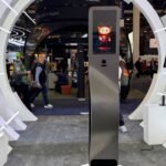 A giant Lockin V7 smart lock on display at CES 2026, showcasing its innovative wireless charging capabilities.