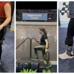 A journalist testing various exoskeletons at the Consumer Electronics Show (CES).