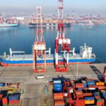 Cargo ship loading and unloading foreign trade containers at Qingdao Port in Qingdao City, Shandong Province, China.