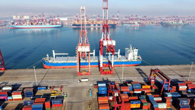 Cargo ship loading and unloading foreign trade containers at Qingdao Port in Qingdao City, Shandong Province, China.
