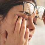 Close-up of an eye, possibly showing irritation or dryness, symbolizing the impact of chronic dry eye disease.