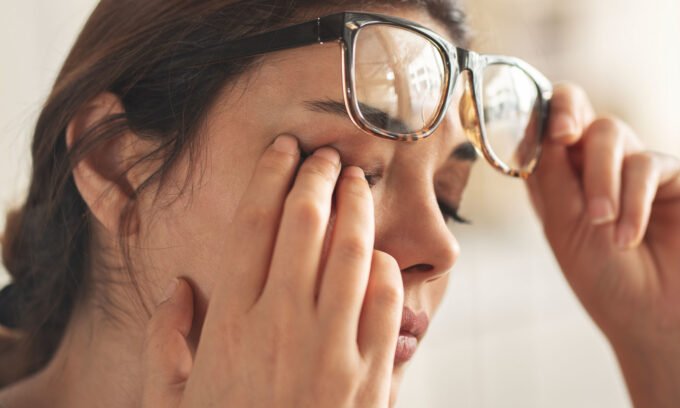 Close-up of an eye, possibly showing irritation or dryness, symbolizing the impact of chronic dry eye disease.