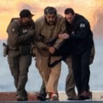 صورة تجمع أعلام فنزويلا وروسيا والصين، أو خريطة توضح موقع فنزويلا في سياق جيوسياسي.