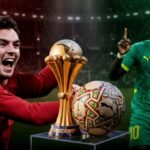 صورة جماعية للاعبي المنتخب المغربي أو المدرب وليد الركراكي خلال مباراة كرة قدم حاسمة.