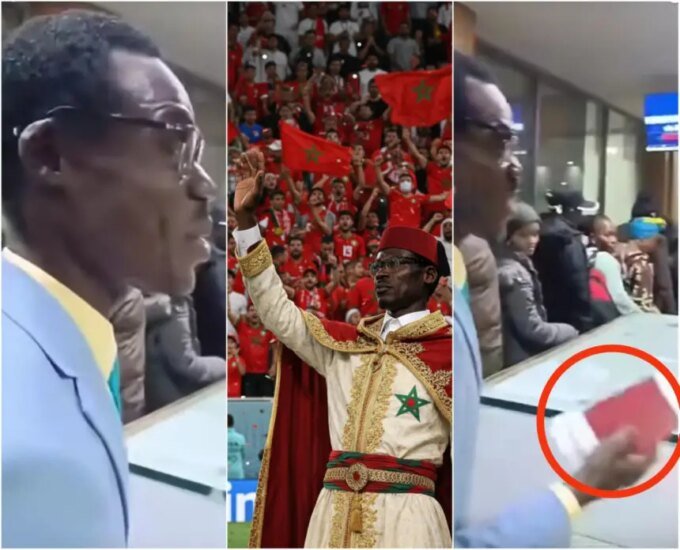 المشجع الكونغولي ميشيل كوكا مبولادينغا المعروف بـ "لومومبا الكونغو" يقدم جواز سفر أحمر اللون في مطار مغربي.