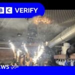 صورة تظهر شرارات نارية تتصاعد من زجاجات شمبانيا بالقرب من سقف حانة، لحظات قبل اندلاع الحريق.