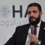 وثيقة المرسوم الرئاسي السوري الخاص بحقوق الأكراد مع علم سوريا