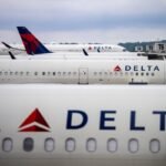 Delta Air Lines aircraft at an airport gate, symbolizing the airline's strategic shift towards premium cabins.