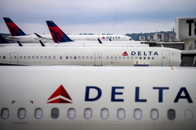 Delta Air Lines aircraft at an airport gate, symbolizing the airline's strategic shift towards premium cabins.