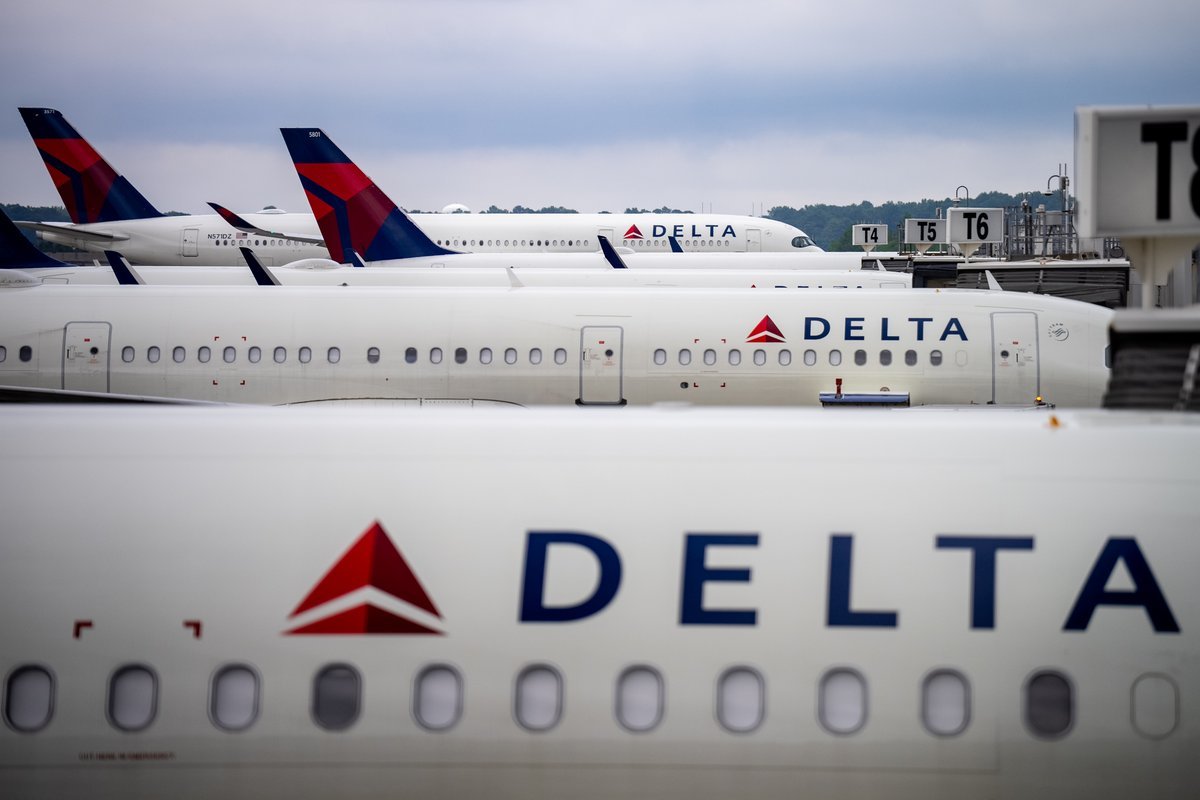 Delta Air Lines aircraft at an airport gate, symbolizing the airline's strategic shift towards premium cabins.