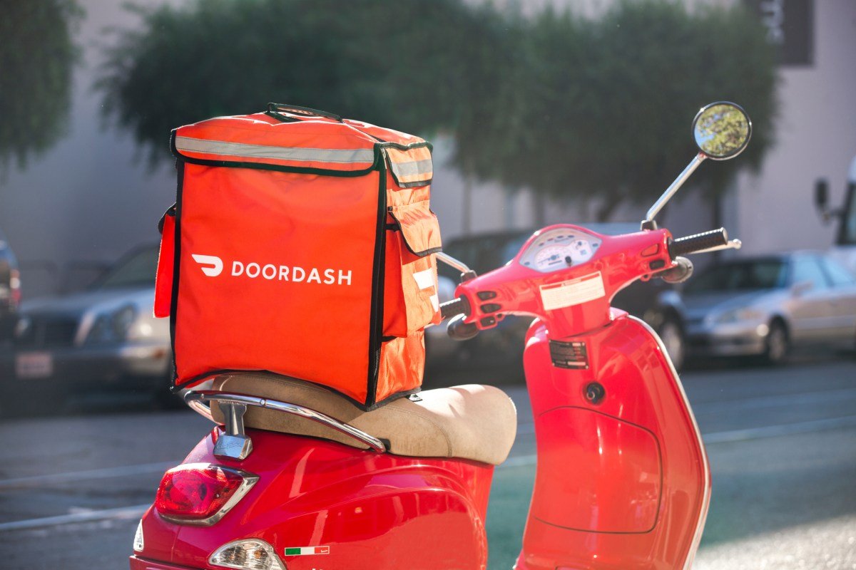 An AI-generated image depicting a DoorDash order package left at a residential front door, central to a delivery fraud incident.