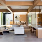 A modern, light-filled interior atrium of the AAHA Studio designed El Segundo residence, showcasing glass and minimalist framing.