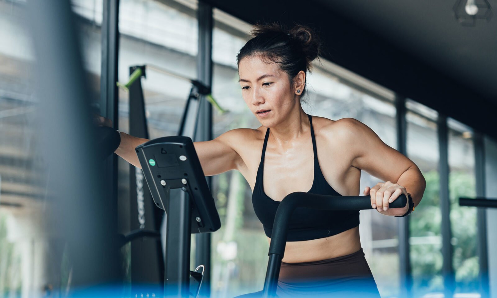 A person actively exercising, symbolizing increased energy expenditure and dynamic metabolism.