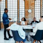 A diverse group of professionals engaging in an interactive workshop, with thought bubbles representing innovative ideas.