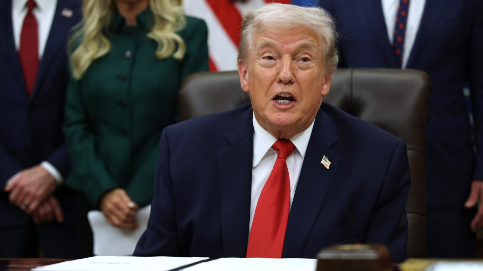 President Donald Trump in the Oval Office discussing the Federal Reserve chair announcement.