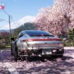 Forza Horizon 6 gameplay screenshot featuring a sports car racing through a vibrant Tokyo street with cherry blossoms.