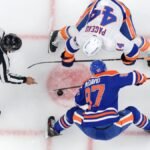 An NHL player in action during a game, illustrating the excitement of live ice hockey.