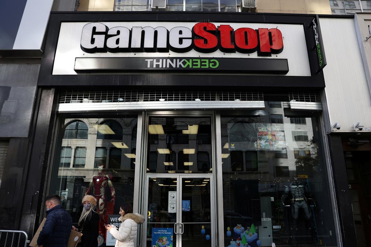 A 'Closed' sign on the door of a GameStop store, symbolizing the company's widespread closures.