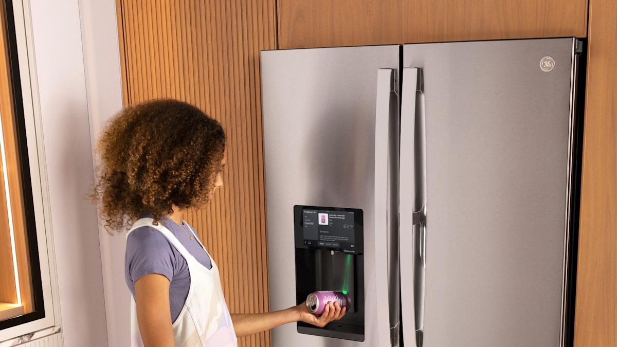 GE's New Smart Refrigerator: Barcode Scanning and Instacart Integration Revolutionize Grocery Shopping 3 A sleek stainless steel GE Profile Smart Refrigerator with a visible touchscreen display and four-door design.
