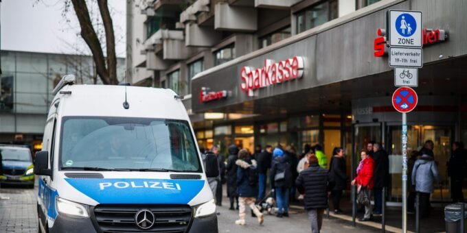 Forensic investigators examining a breached bank vault in Germany after a multi-million euro heist.