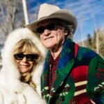 Goldie Hawn and Kurt Russell smiling together, embodying a long-lasting celebrity relationship.