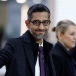 Sundar Pichai, Google CEO, waves as he arrives at the Artificial Intelligence Action Summit in Paris.