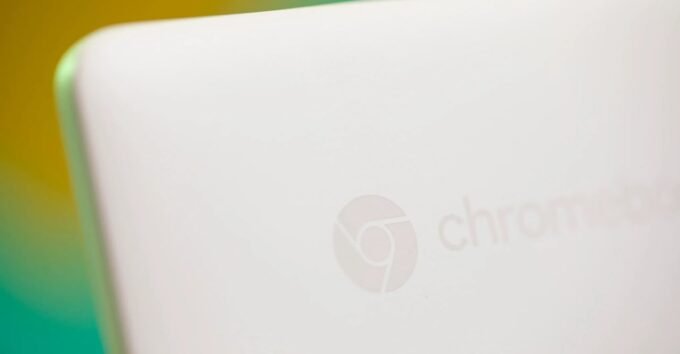 A Chromebook laptop open in a classroom setting, symbolizing Google's presence in education.