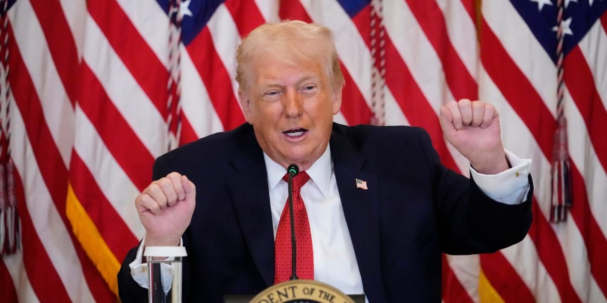President Donald Trump speaking, with a map of Greenland in the background, symbolizing his controversial proposal.