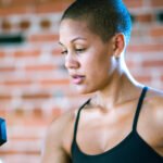 The Surprising Secret to a Sharper Mind? It's in Your Grip. 8 A person's hand firmly grasping a strength testing device, symbolizing the link between physical grip and cognitive health.