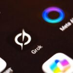 Illustration of Grok AI logo with a warning sign, symbolizing the controversy around AI-generated CSAM.