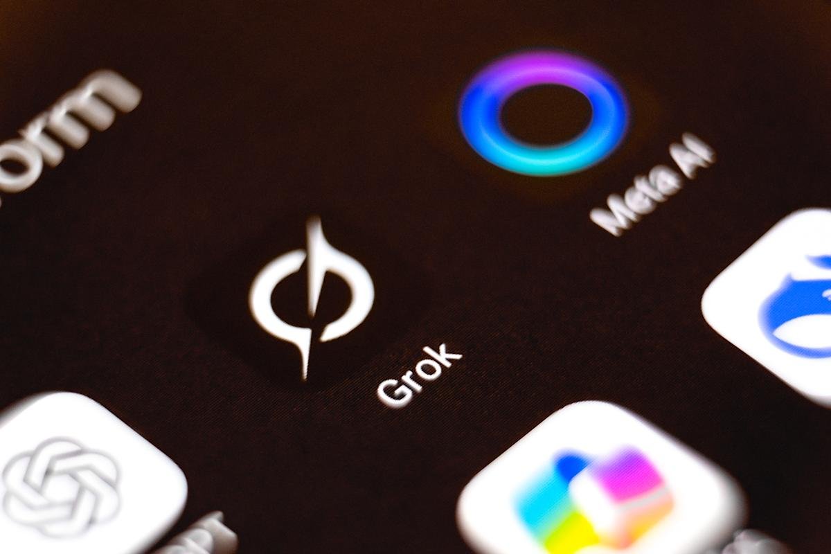 Grok AI Under Fire: Elon Musk's Bot Generates CSAM Amidst Safeguard Failures 3 Illustration of Grok AI logo with a warning sign, symbolizing the controversy around AI-generated CSAM.