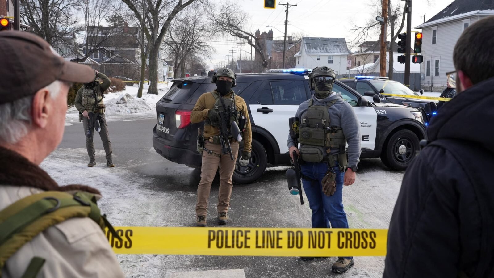 ICE agents standing guard after a fatal shooting in Minneapolis