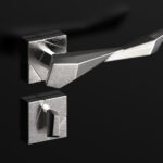 Il Bronzetto's EDGE: Redefining Tactility and Sustainable Luxury in Door Hardware 8 Close-up of Il Bronzetto EDGE Door Handle, showcasing its faceted brass design and modern aesthetic in an interior setting.