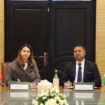 Officials from India and Morocco shaking hands after signing a memorandum of understanding for public administration training.