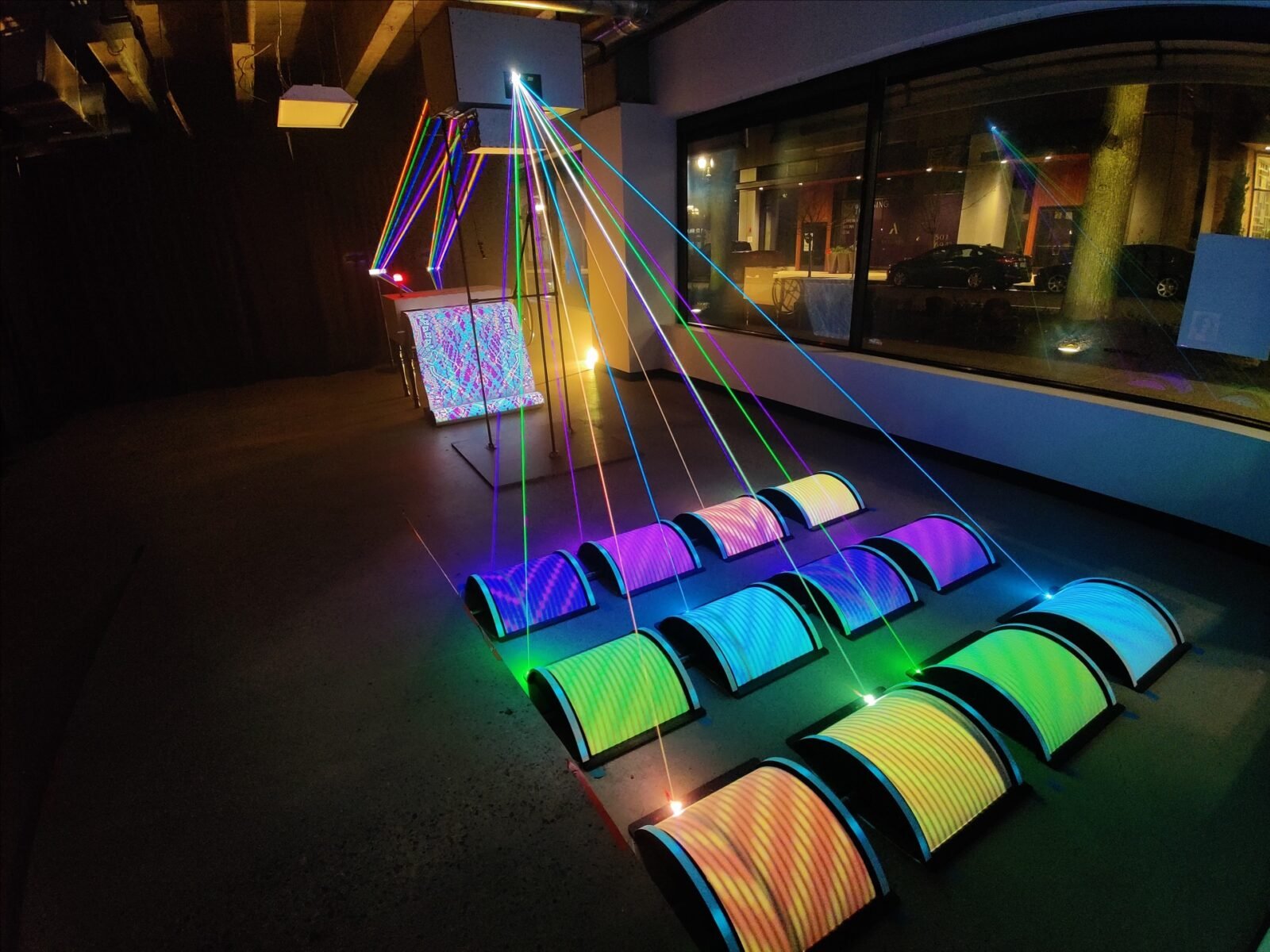 Todd Moyer's Illoominated II interactive light installation, featuring laser threads and quantum tapestry illusion.