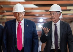 US President Donald Trump speaks with Federal Reserve chair Jerome Powell during a visit to the Federal Reserve in Washington, DC.