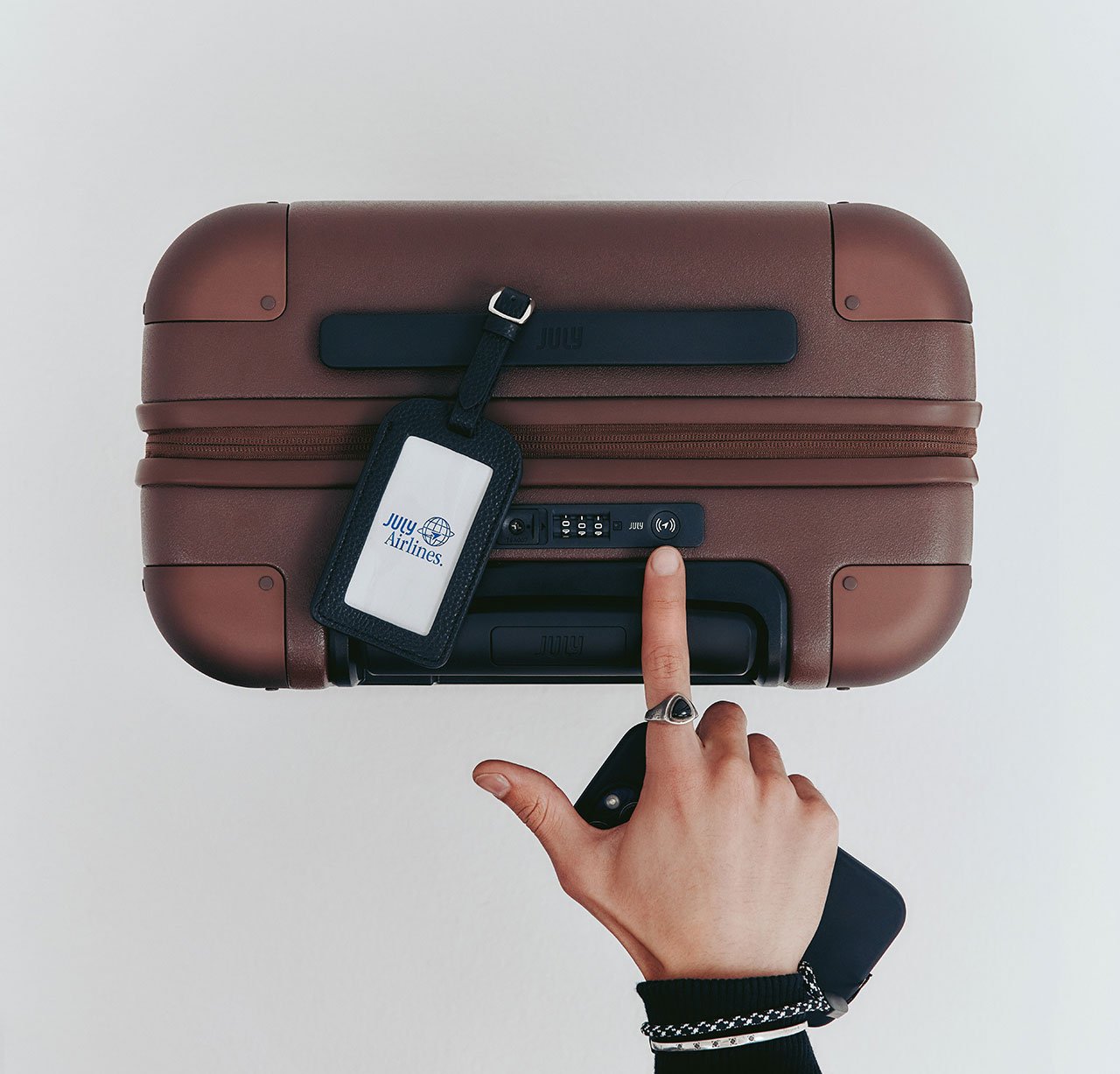 Never Lose Your Luggage Again: July Unveils CaseSafe with Built-in Tracking 3 July CaseSafe smart suitcase in a signature color, showcasing its sleek design and integrated tracking lock.