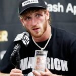 Logan Paul wearing his rare Pikachu Illustrator Pokémon card as a necklace, symbolizing his blend of passion and investment.