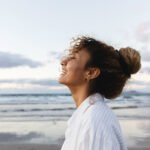 A serene bedroom scene with a bottle of sleep support+ magnesium supplement on a nightstand, symbolizing restful sleep.