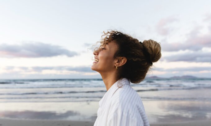 A serene bedroom scene with a bottle of sleep support+ magnesium supplement on a nightstand, symbolizing restful sleep.