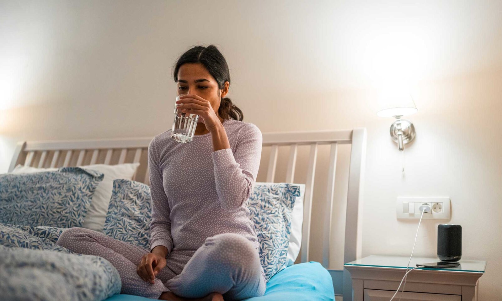 A person sleeping peacefully, with a subtle glow representing natural calm and rest.