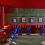 Portrait of Maye Ruiz, an interior designer, in a creatively designed space.