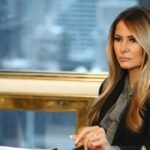 Melania Trump in sunglasses, featured in the documentary trailer, walking in a grand room.